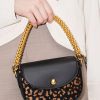hSQATNAWuYcTFkkv.jpg Beaded Metallic Handle Sculptural Bag – Animal Print Black